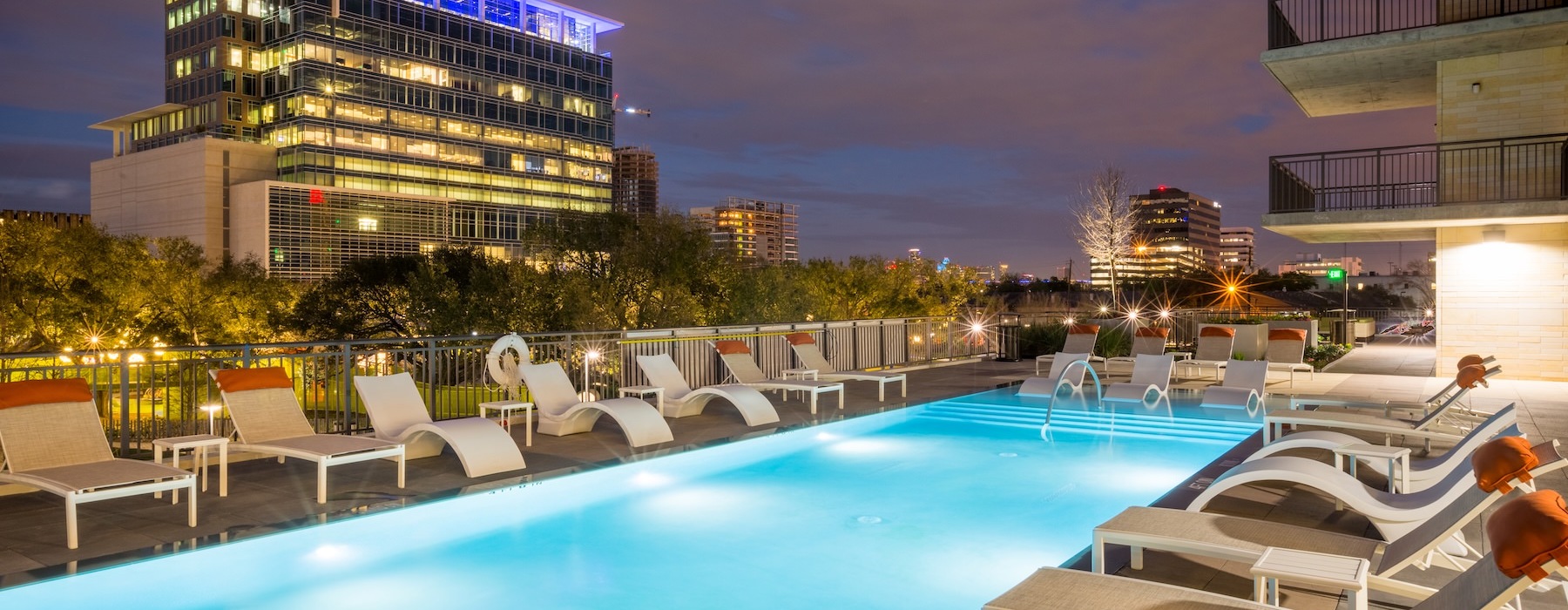 a pool with chairs around it