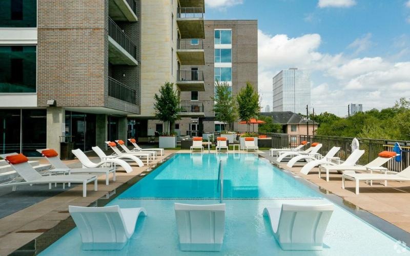 a pool with chairs around it