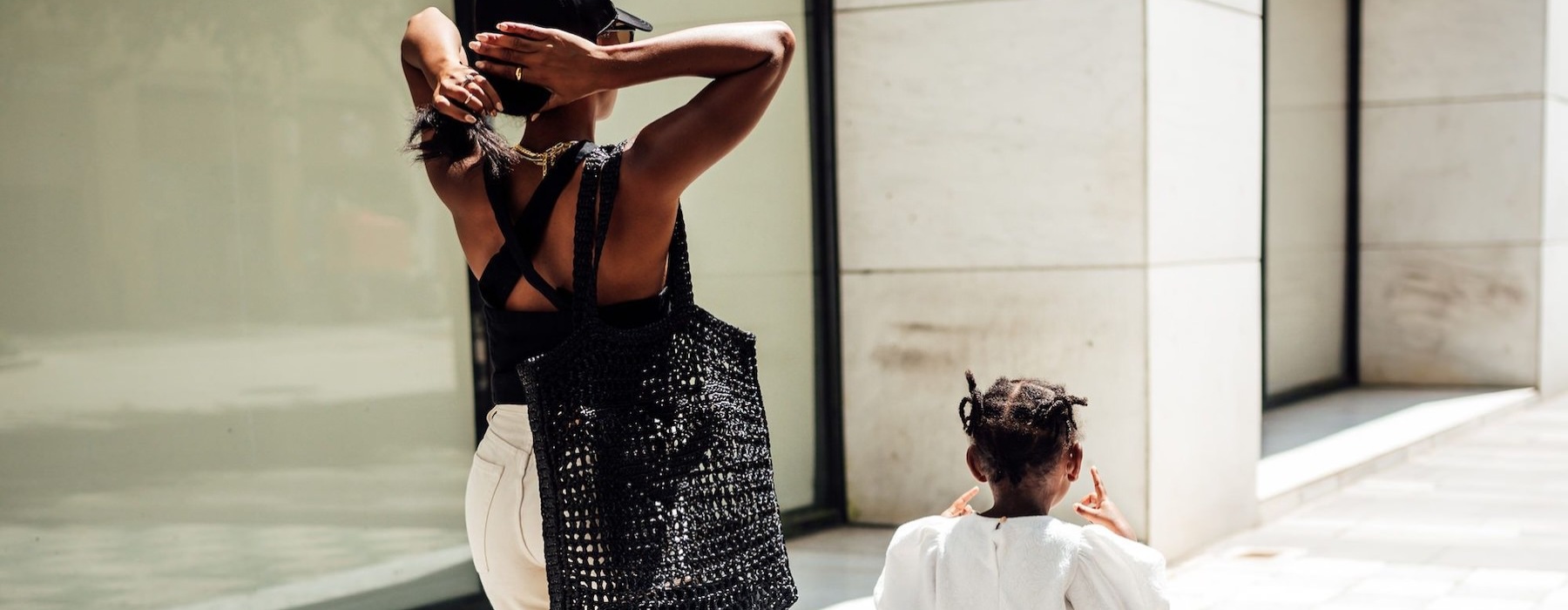 a woman walking with her child