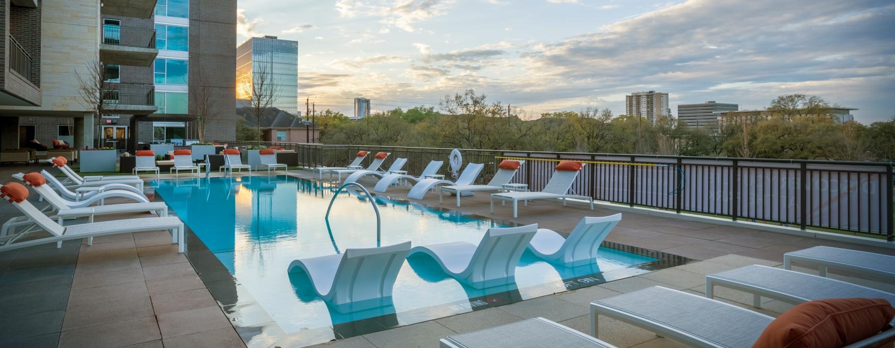 a pool with chairs around it